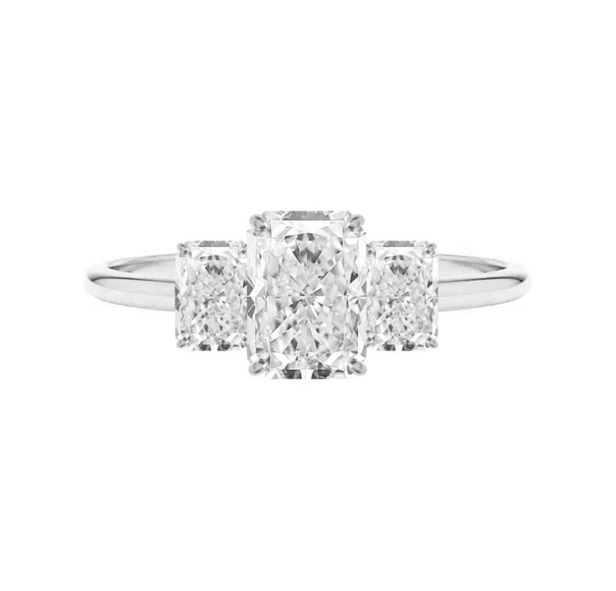 Three stone radiant cut diamond engagement ring in white gold