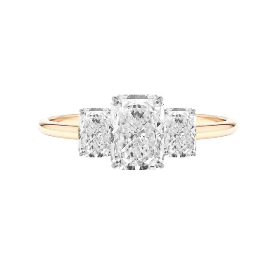 Three stone radiant cut diamond engagement ring in yellow gold