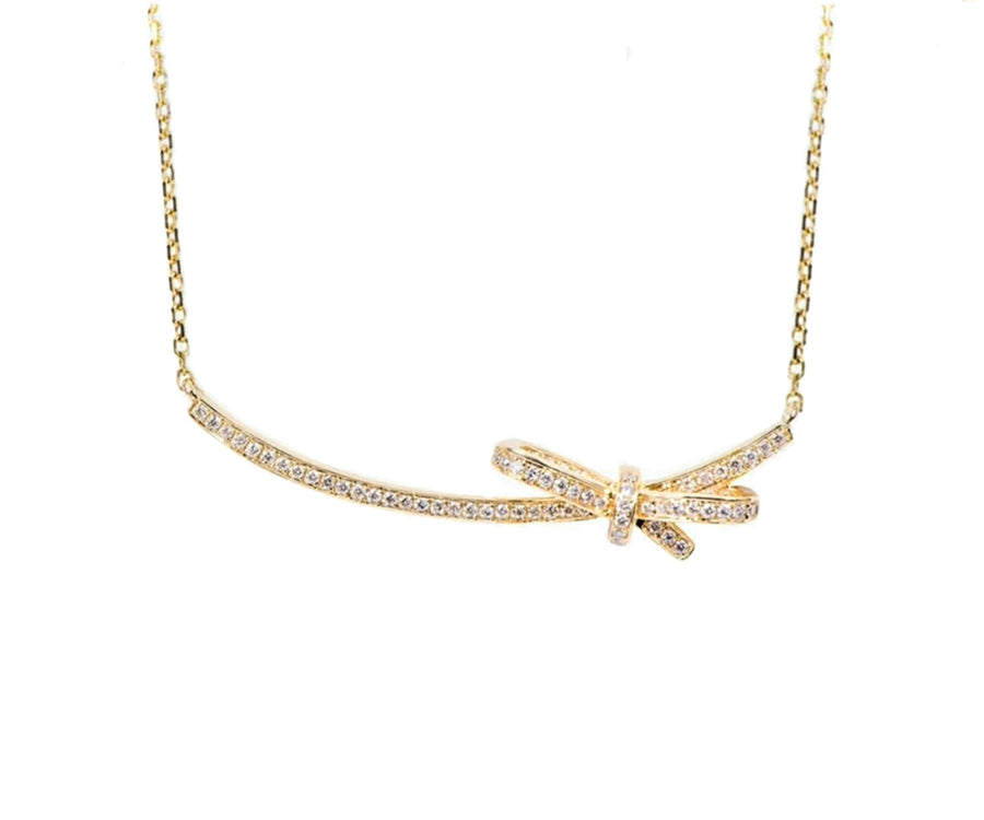 Yellow gold diamond bow bar necklace